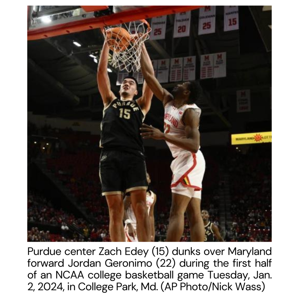 Purdue, C, Zach Edey (15) dunks over Maryland forward Jordan Geronimo (22) during the first half of an NCAA college basketball game, Tuesday, Jan. 2, 2024, in College Park, Md. (AP Photo/Nick Wass)